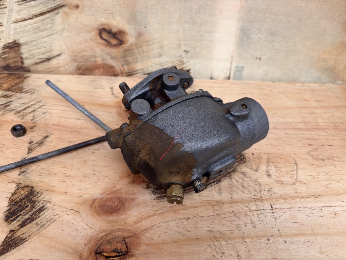 Marvel carburetor during laser rust removal showing clean vs rusty