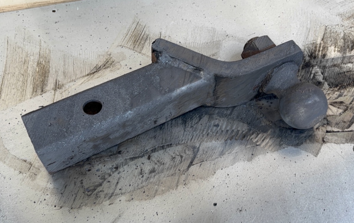 Trailer hitch after laser rust removal — clean bare metal