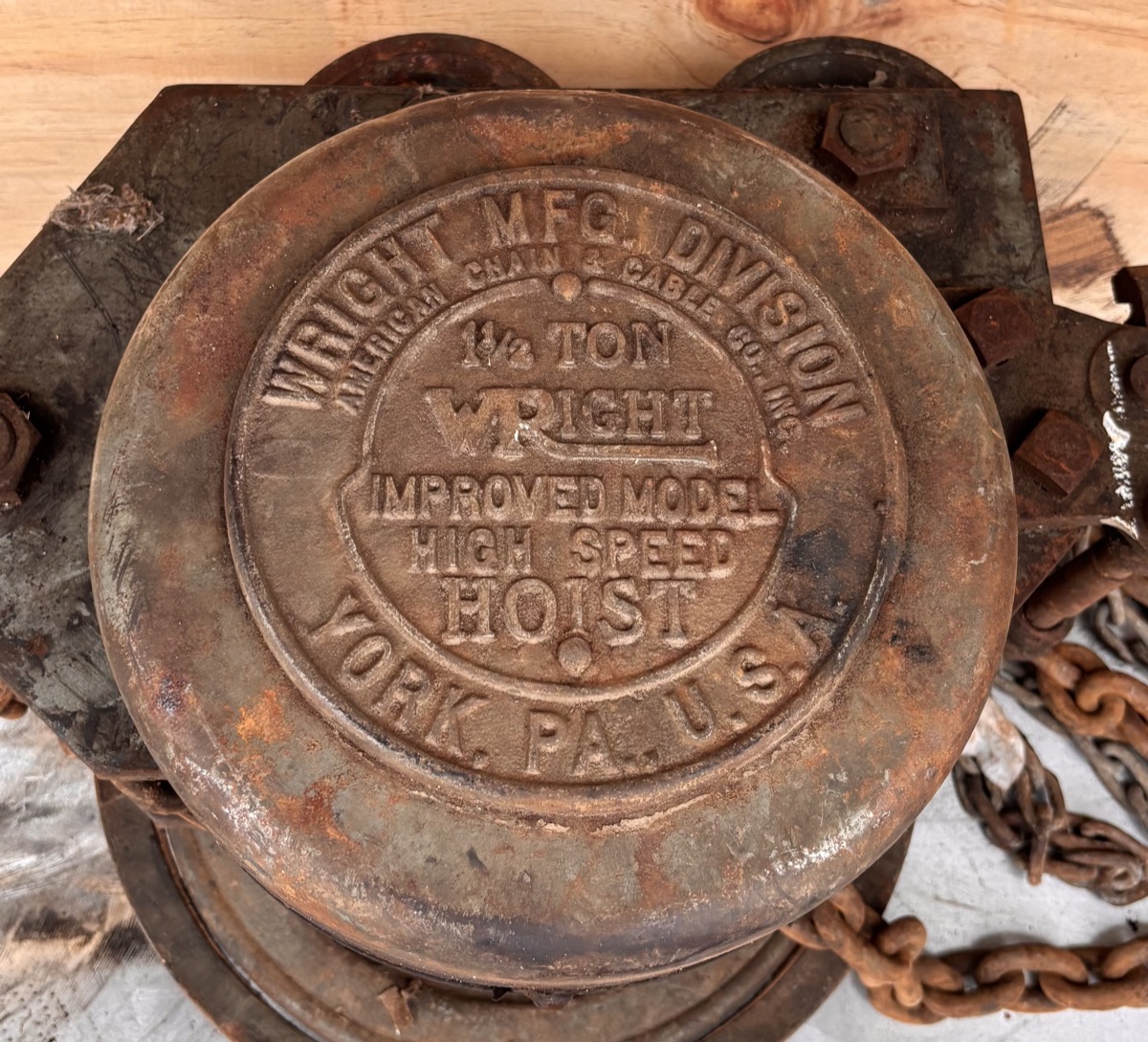 Rusted Wright chain hoist before laser cleaning